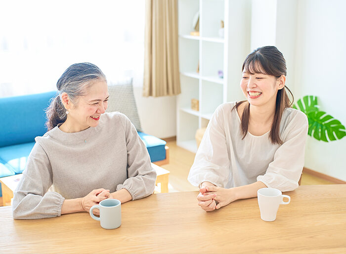 Two women sharing a warm conversation over coffee